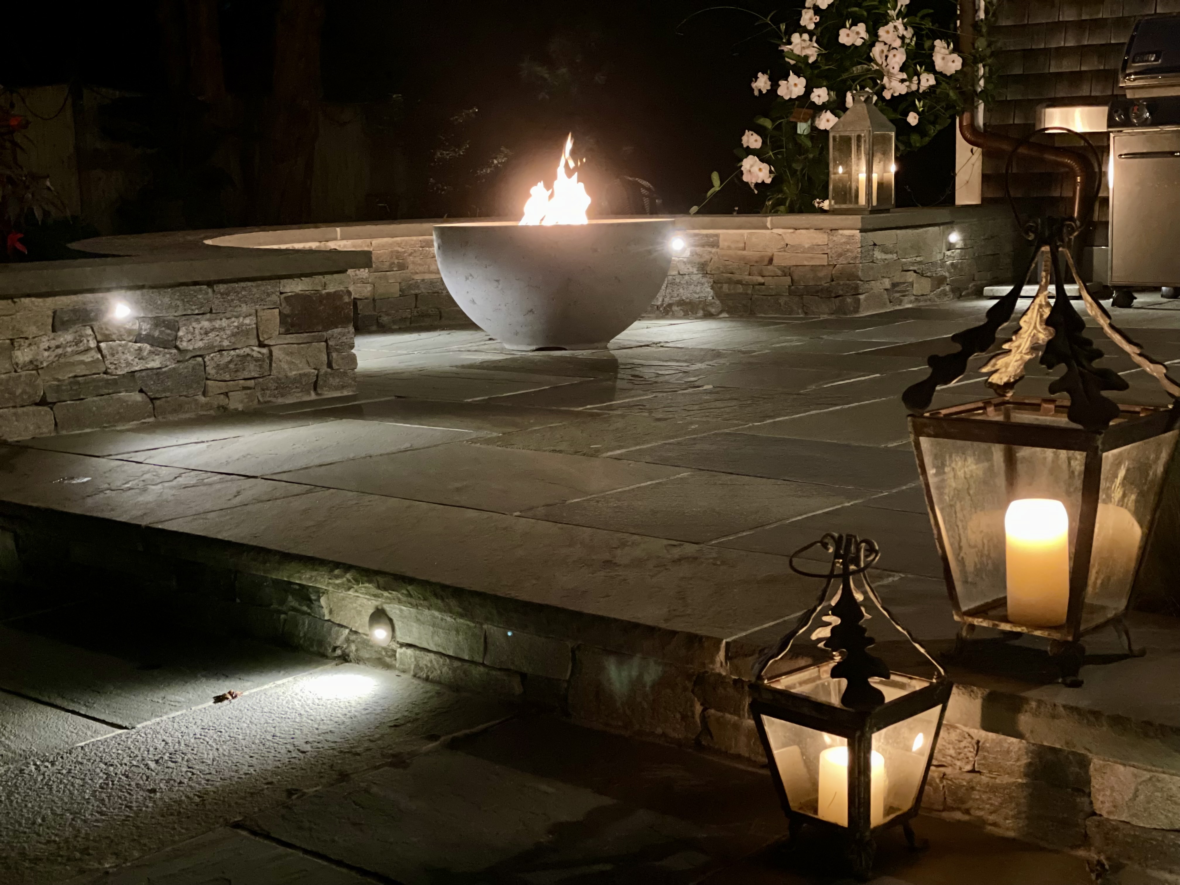 fire bowl at night with lanterns